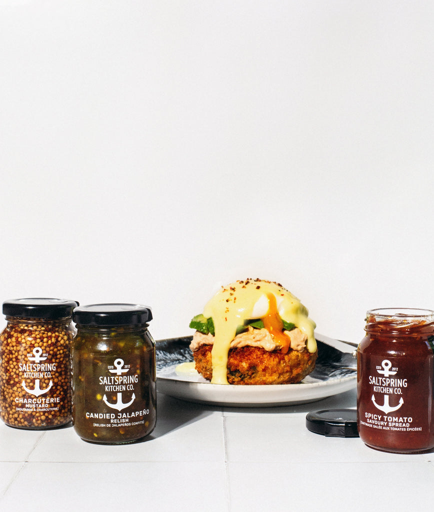 SaltSpring Kitchen Company Crab Cake Eggs Benny dish with small jars of preserves from the Gourmet Burger Collection Trio Box