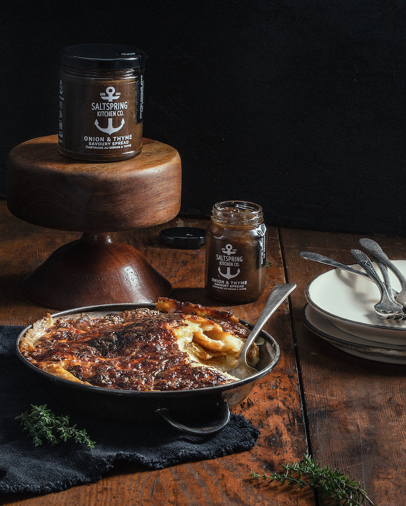 Salt Spring Kitchen Company Onion and Thyme Savoury Spread jars with Onion Thyme Scalloped Potatoes in a serving dish