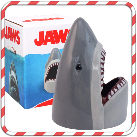 A ceramic Jaws desk tidy - the shark's head with an open mouth to place pens inside.