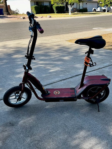 A red sit-down electric scooter