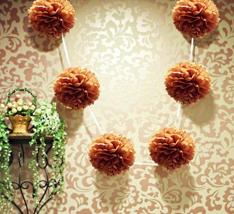 https://cdn.shopify.com/s/files/1/0469/3629/3530/products/brown-tissue-pom-pom-garland_large.jpg?v=1603737277