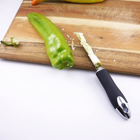 Corer next to jalapeno with the seeds on top 