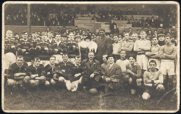 JOHNSON, JACK REAL PHOTO POSTCARD (AT A RUGBY MATCH-1915)
