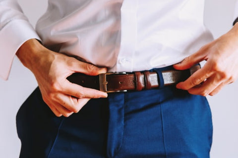 a man wearing a leather belt