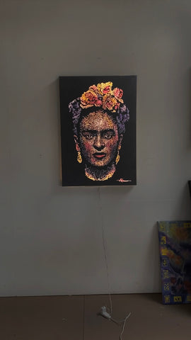 The glowing painting by artist Marilena Hamm aka Scribblezone depicting a portrait of Frida Kahlo.
