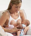 women breastfeeding baby cuddle clutch hold