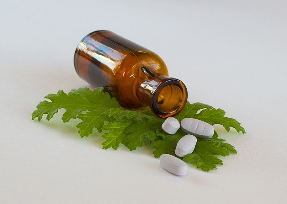 leaf, glass bottle & tablets