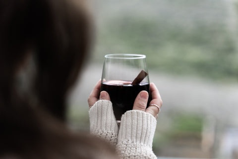 woman drinking alcohol free new years eve mulled wine cocktail