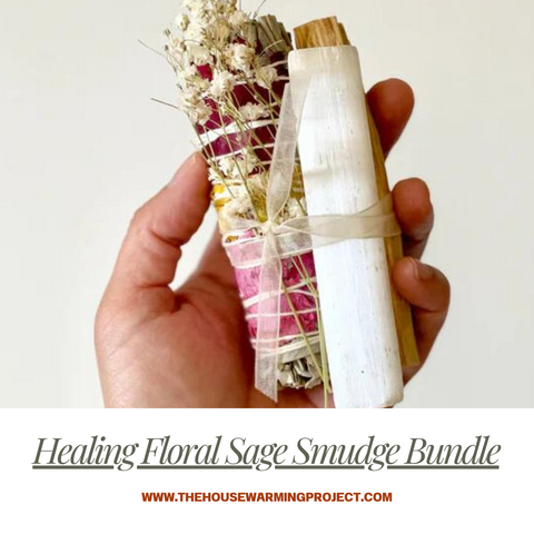 Hand holding Healing Floral Sage Smudge Bundle.