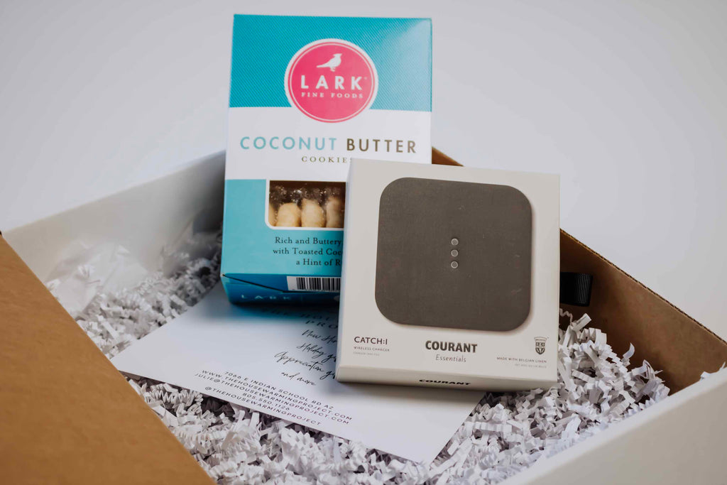 Open corporate giftbox with butter cookies and wireless charger