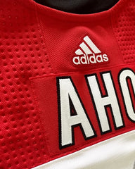 Comparing a pre-stitched to a hand-stitched Adidas Jersey 