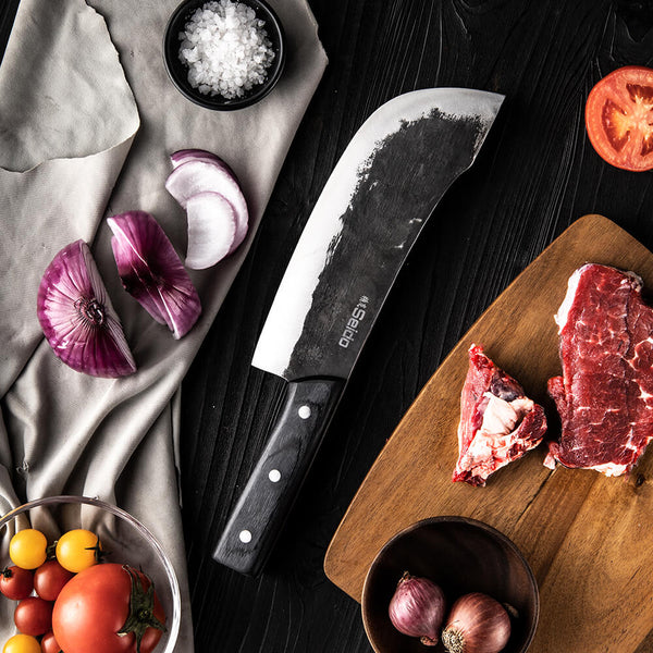 Butcher knife displayed on cutting board