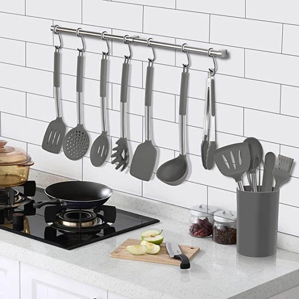 Essential prep tool set, kitchen demonstrating of cutlery suspended from their hanging hole