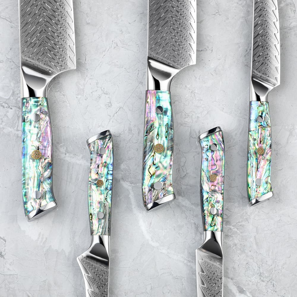 Awabi Series Knives, showcasing their exquisit abalone handles and Damascus blade