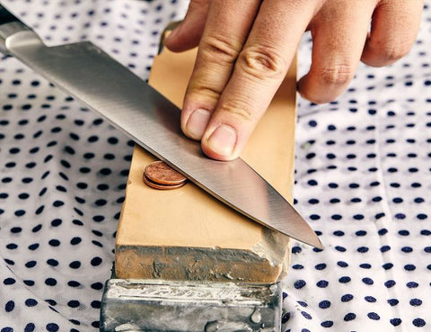 Knife sharpening with a whetstone safety tip