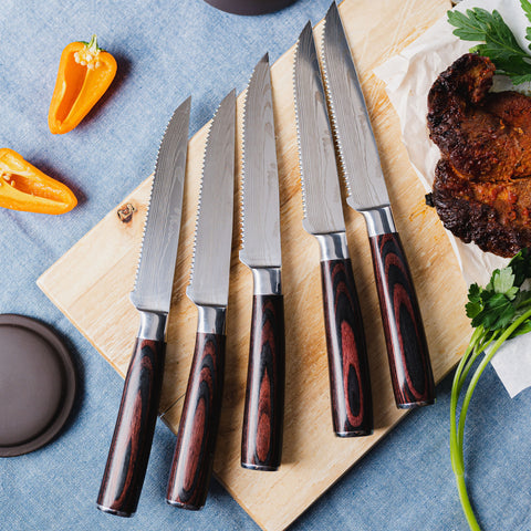 Serrated Steak Knives with sharp, toothed edges designed for effortless steak cutting