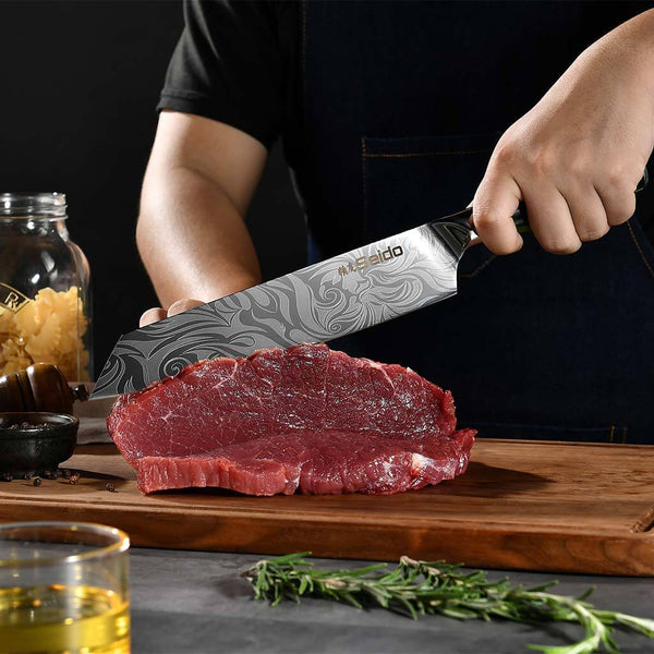Green Japanese 8 inch Kiritsuke knife filleting meat.