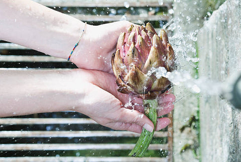 Rinse your artichokes in cold water