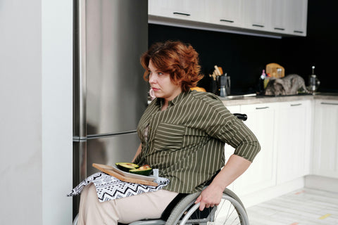 Woman in her kitchen in a wheelchair