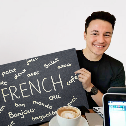A guy holding a French poster
