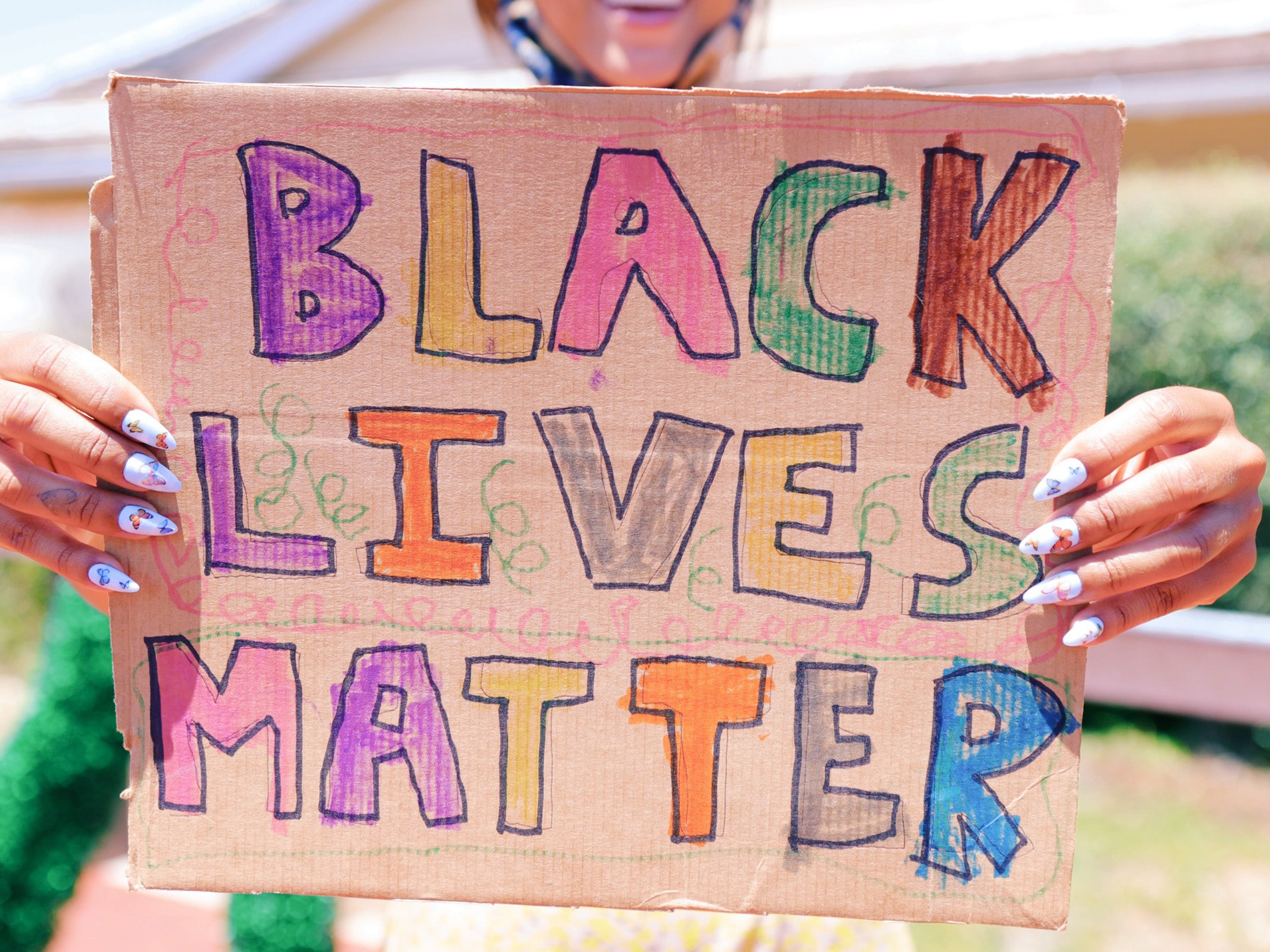 Sign that says Black Lives Matter in colorful letters