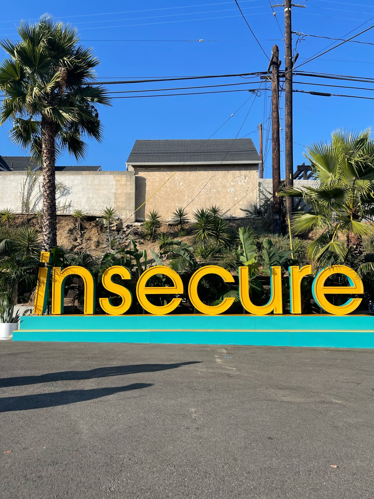 Insecure sign in yellow at Insecure Fest