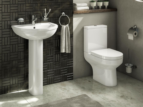 Elegant corner toilet in a modern bathroom with space-saving design