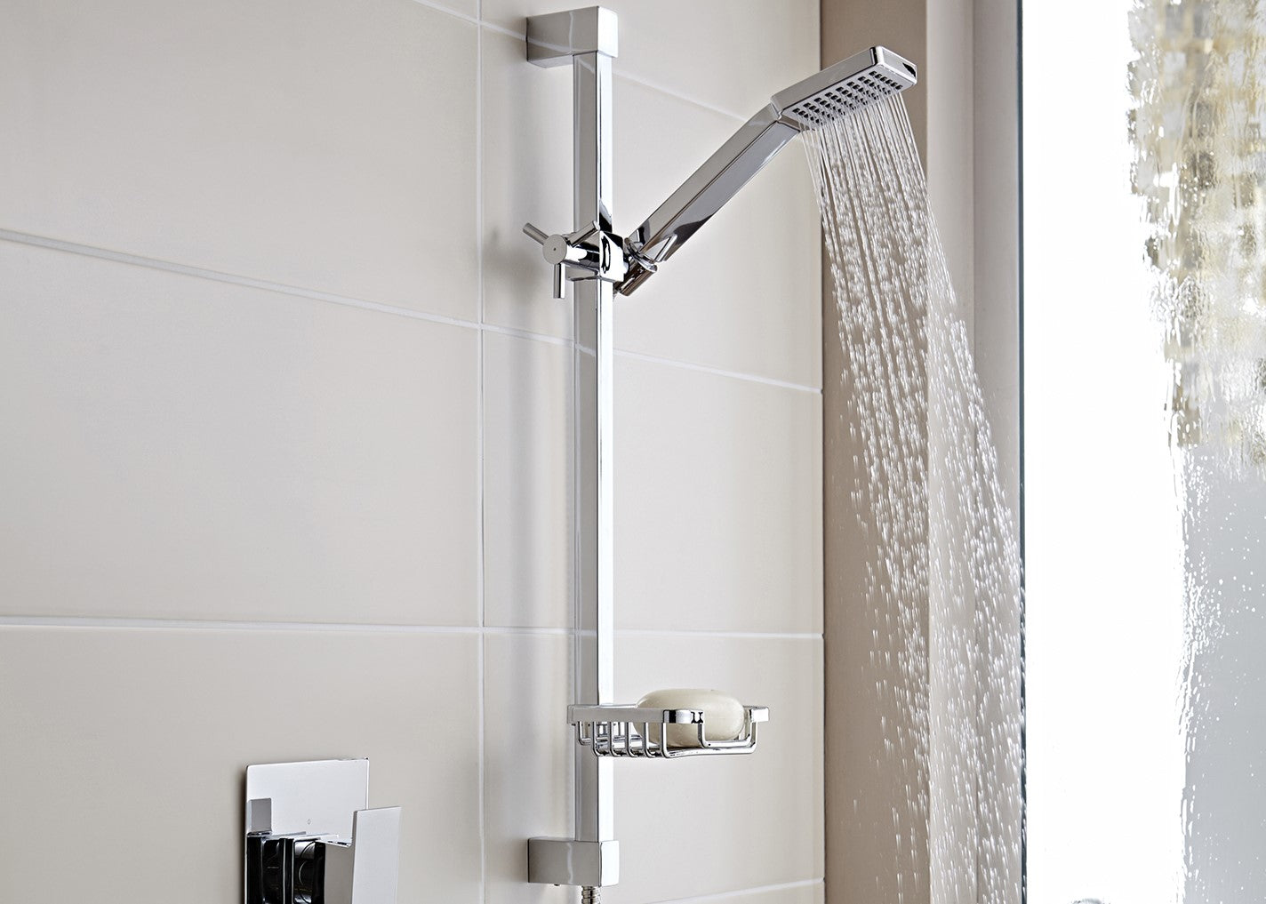Plumber installing thermostatic shower valve in bathroom