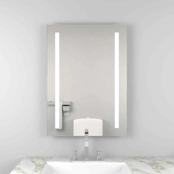 A rectangular mirror with a black metal frame, mounted on a wall and reflecting natural light, adding depth to the room.