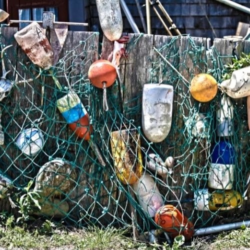 Colorful lobstertrap buoys on Nantucket fence