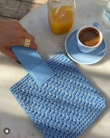 Binge Knitting Baby Blue bag with leather handle.