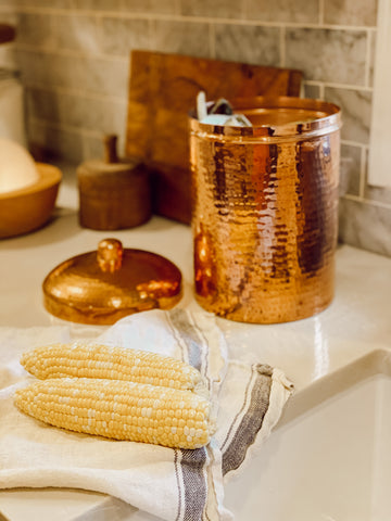 Composting corn in copper composting bins