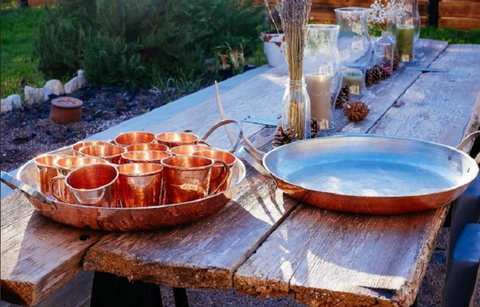 Copper paella pan as a serving tray