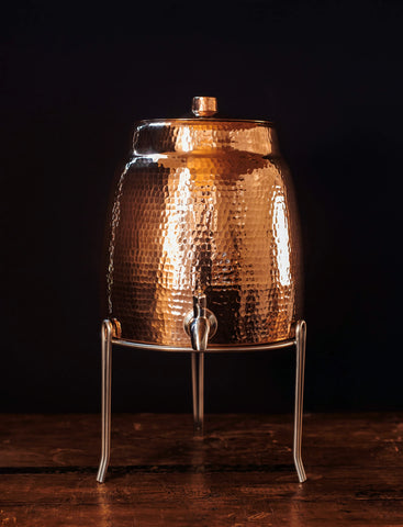 Copper Water Dispenser With Lid On Stainless Steel Stand