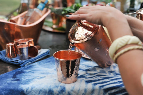 The ancient Ayurvedic practice of drinking and storing water in copper water vessels.