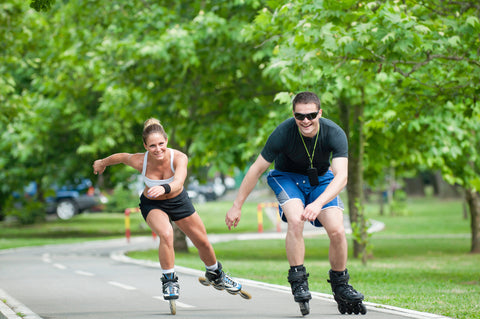 couple having fun rollerblading