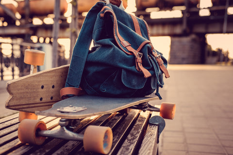 longboard with backpack on it