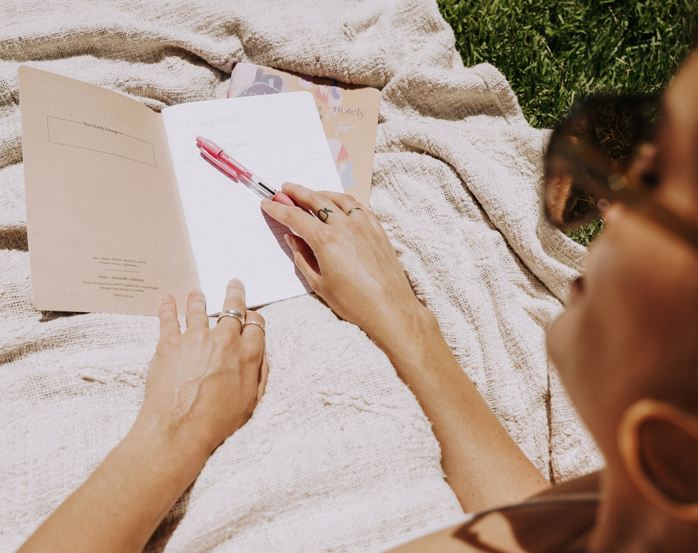 Relaxing and journaling in the park for end of year reflections