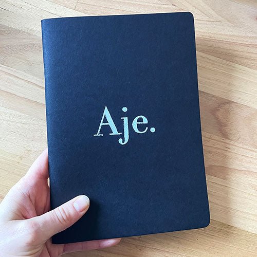 Custom sustainable notebooks for clothing brand AJE