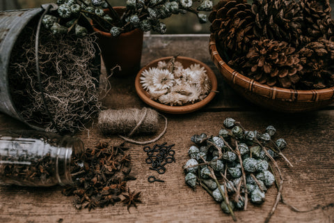 winter holiday festive craft pinecone silver bells moss strawflower anise