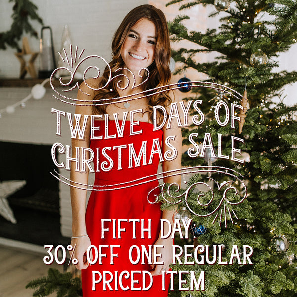 Girl in a Red Dress Standing By a Christmas Tree