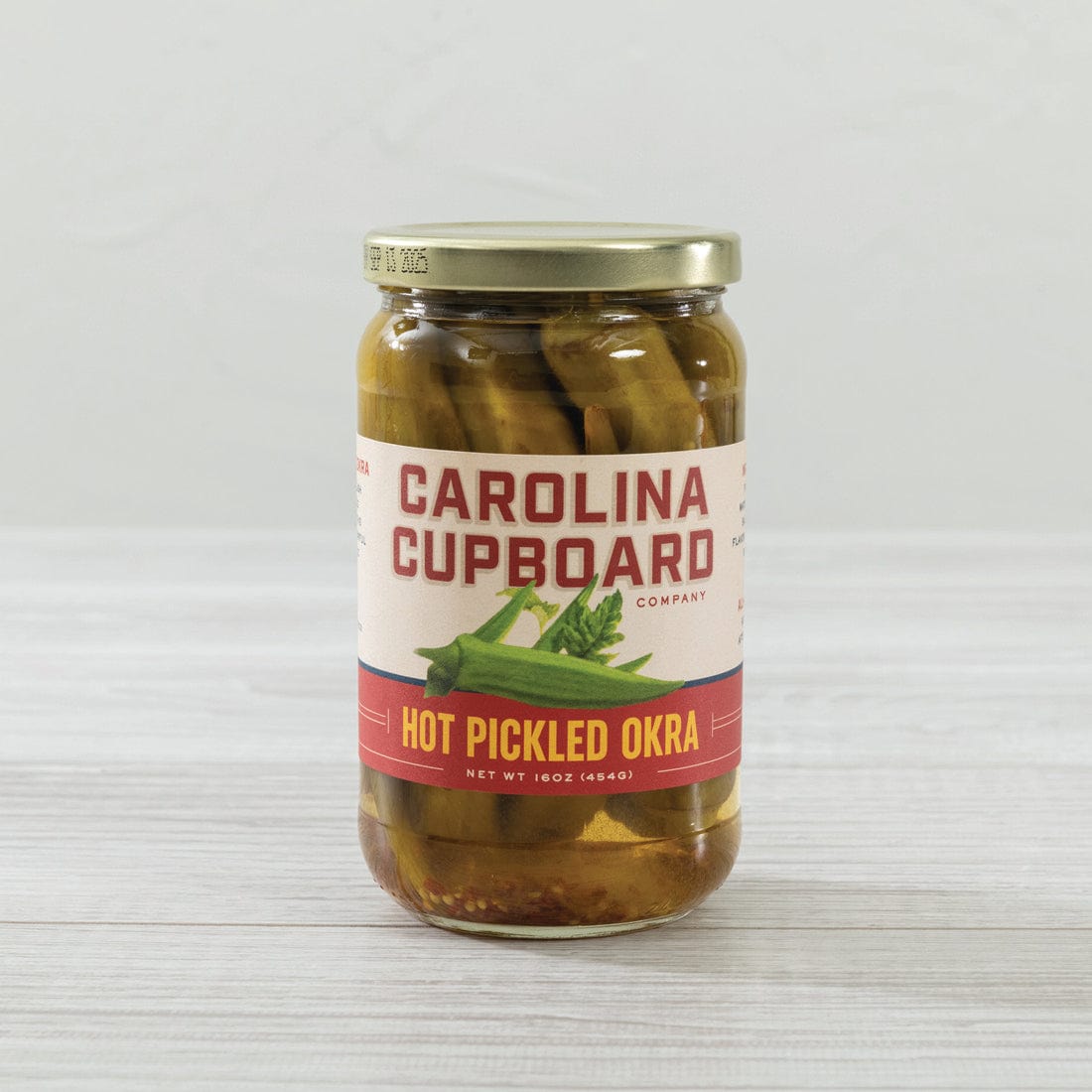 https://cdn.shopify.com/s/files/1/0472/3146/7683/products/southern-season-hot-pickled-okra-16-oz-36158594318499_1600x.jpg?v=1669127499