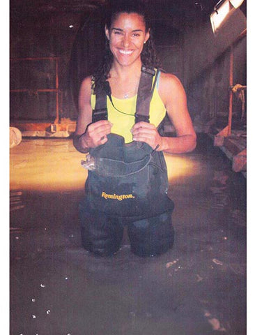 Nina Jones aka Nina J Skates on the set of Alien vs. Predator II, working as a lighting technician.  Lamp Operator, Set Electrician.  She wears a tank top and hip waders, stands crotch-deep in murky water.  Luckily this is a sewer recreation in the studio!