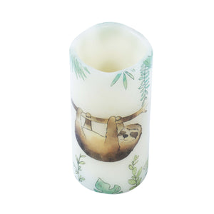 sleeping sloth led candle on white background