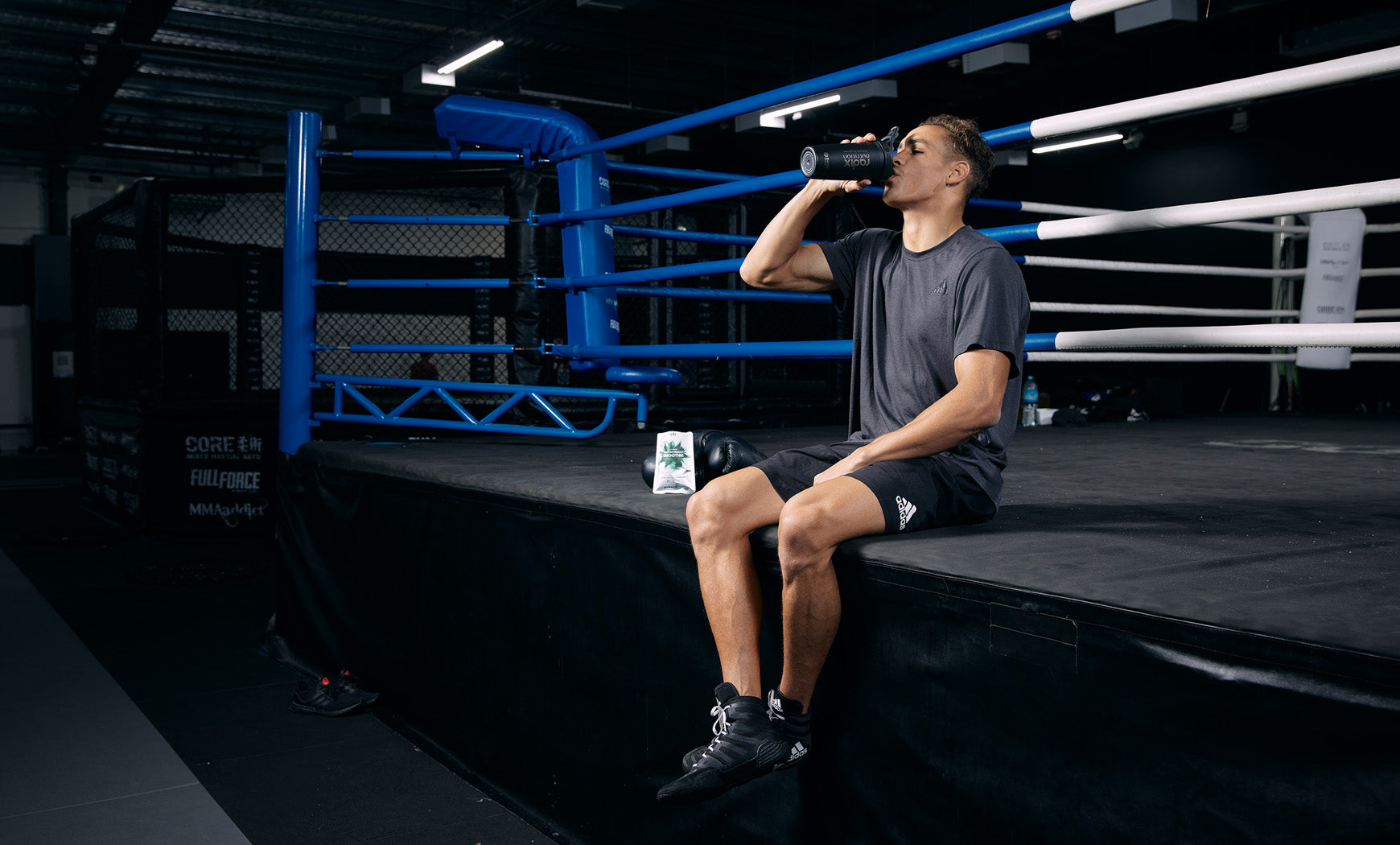 David Nyika Drinking Radix Nutrition Recovery Smoothie in Boxing Gym