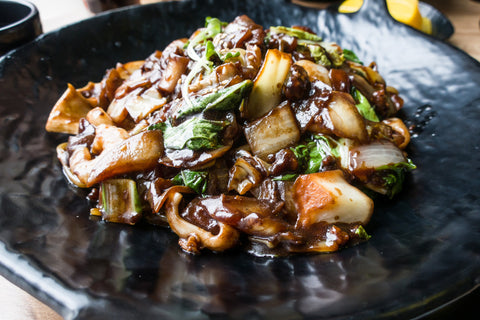 plate of cooked mushrooms and vegetables