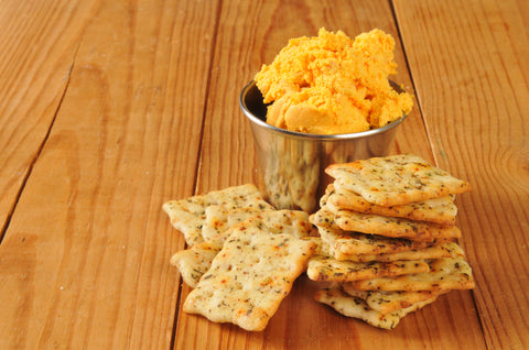 Herbal flatbread crackers with cheese spread