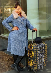 Teya the founder of The Passport Hustle Press Release with Black and Gold Luggage Cover