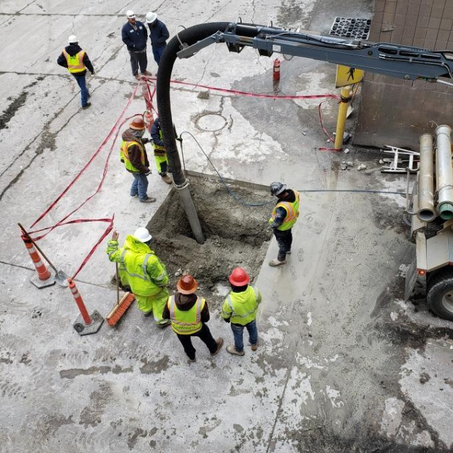 Construction crew working on digging a hole