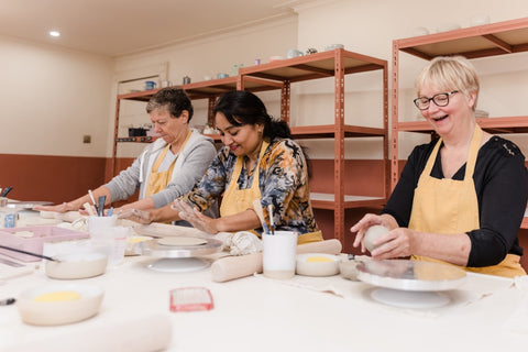 Women making pottery in a pottery class